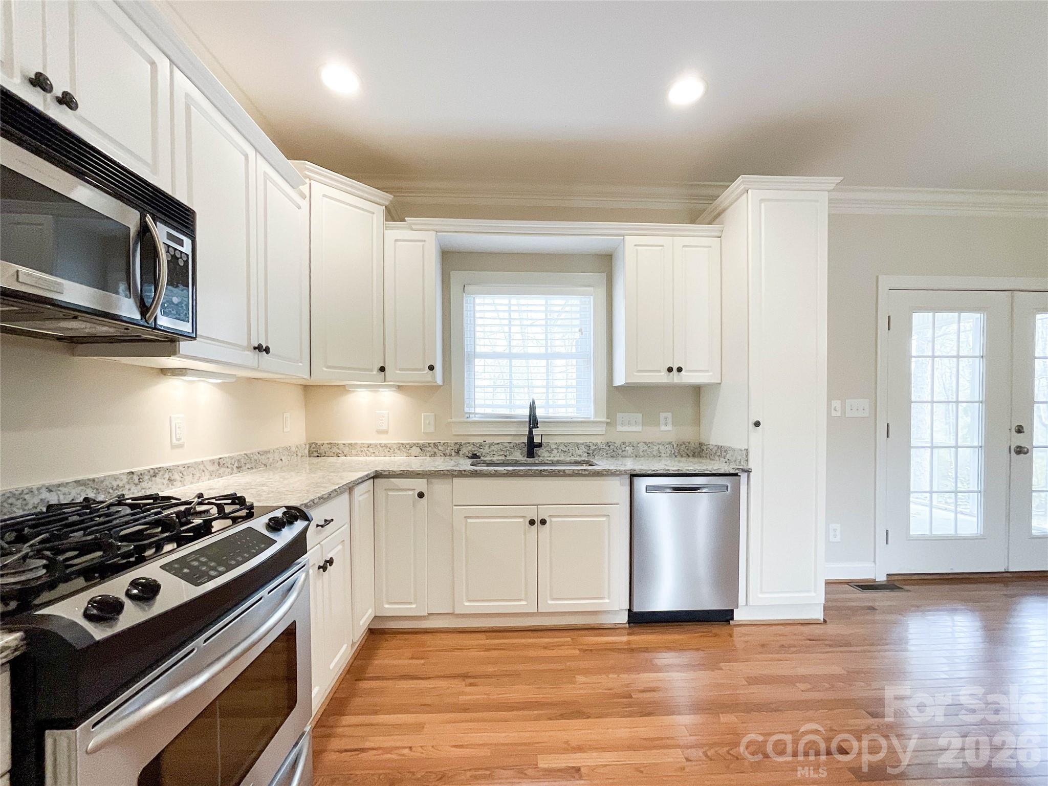 62 Will Evans Road Jefferson, SC 29718 - Photo 11 of 48 a kitchen with stainless steel appliances granite countertop a stove and a sink
