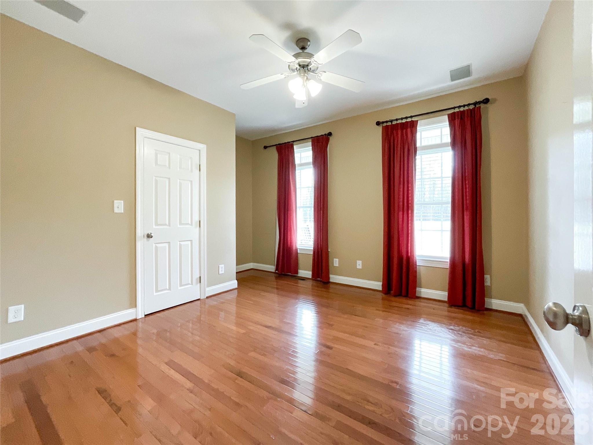 62 Will Evans Road Jefferson, SC 29718 - Photo 13 of 48 a view of an empty room with window and wooden floor