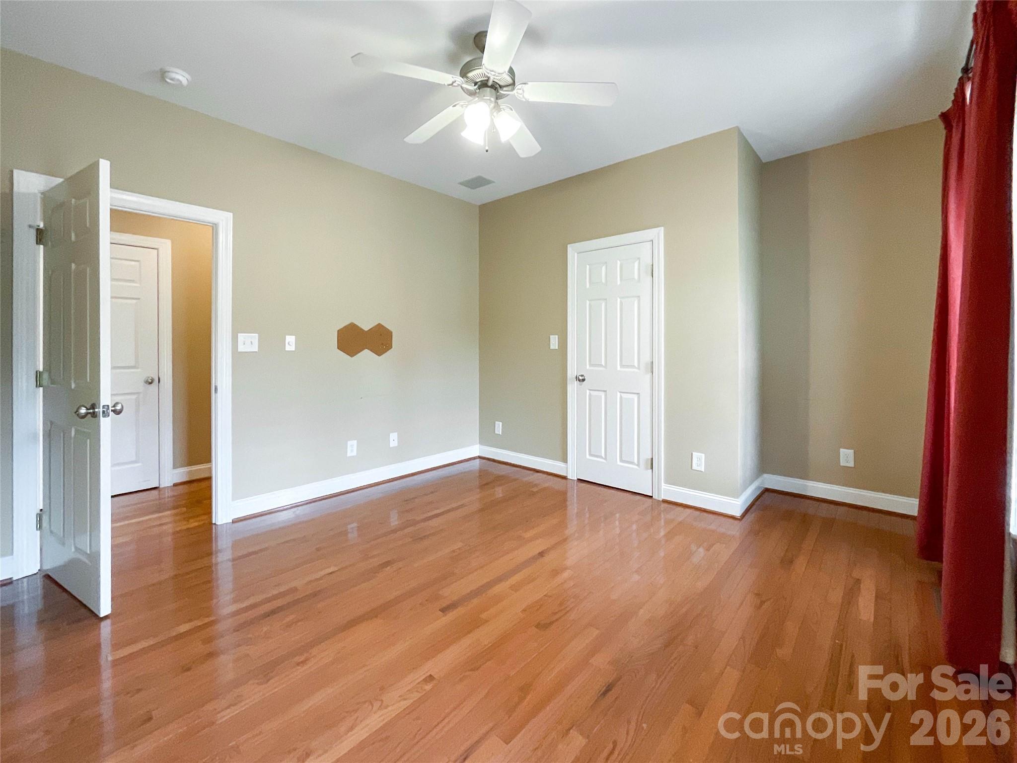 62 Will Evans Road Jefferson, SC 29718 - Photo 14 of 48 an empty room with wooden floor and windows