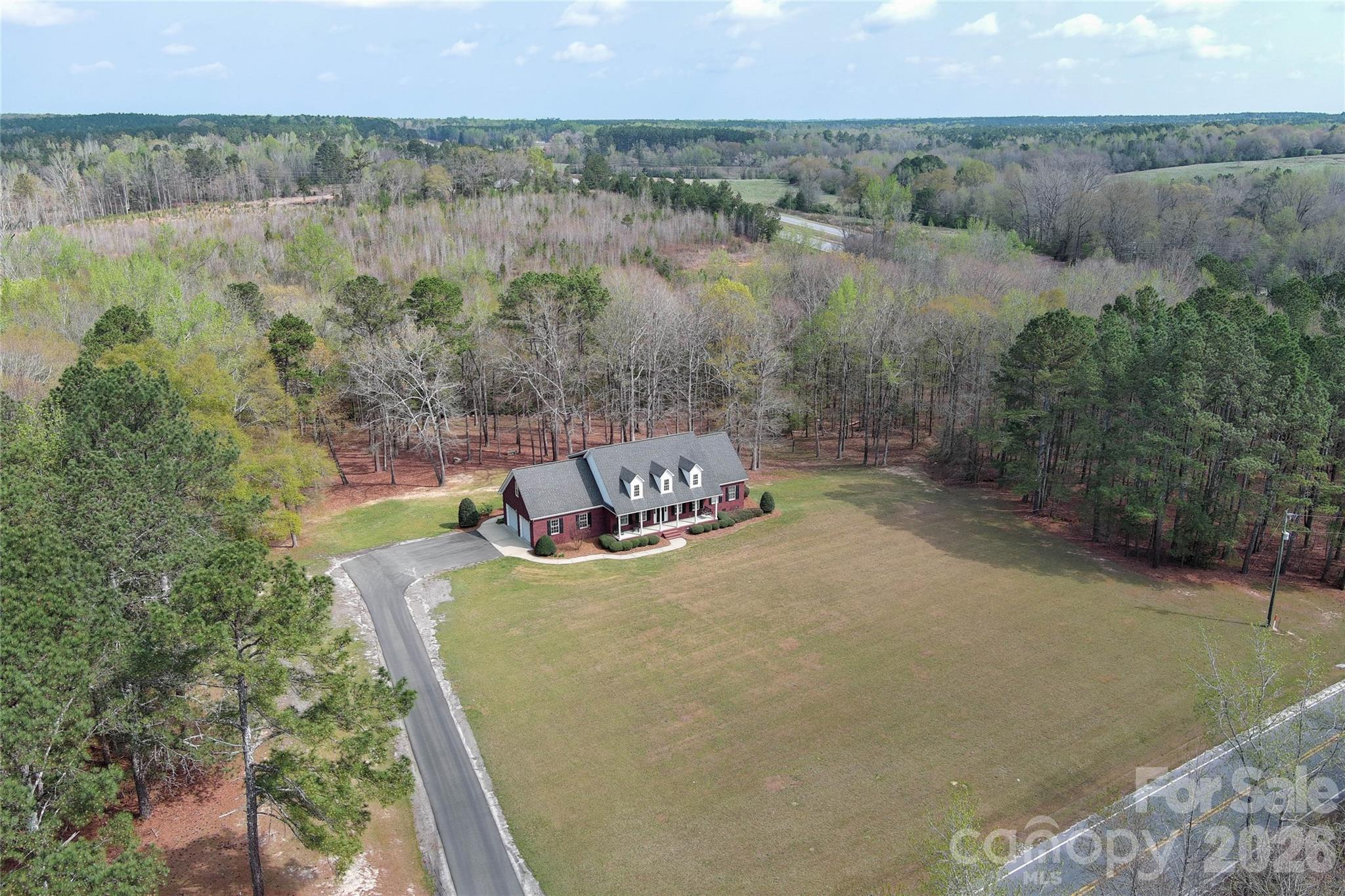 62 Will Evans Road Jefferson, SC 29718 - Photo 2 of 48 a view of a lake with a mountain in the back