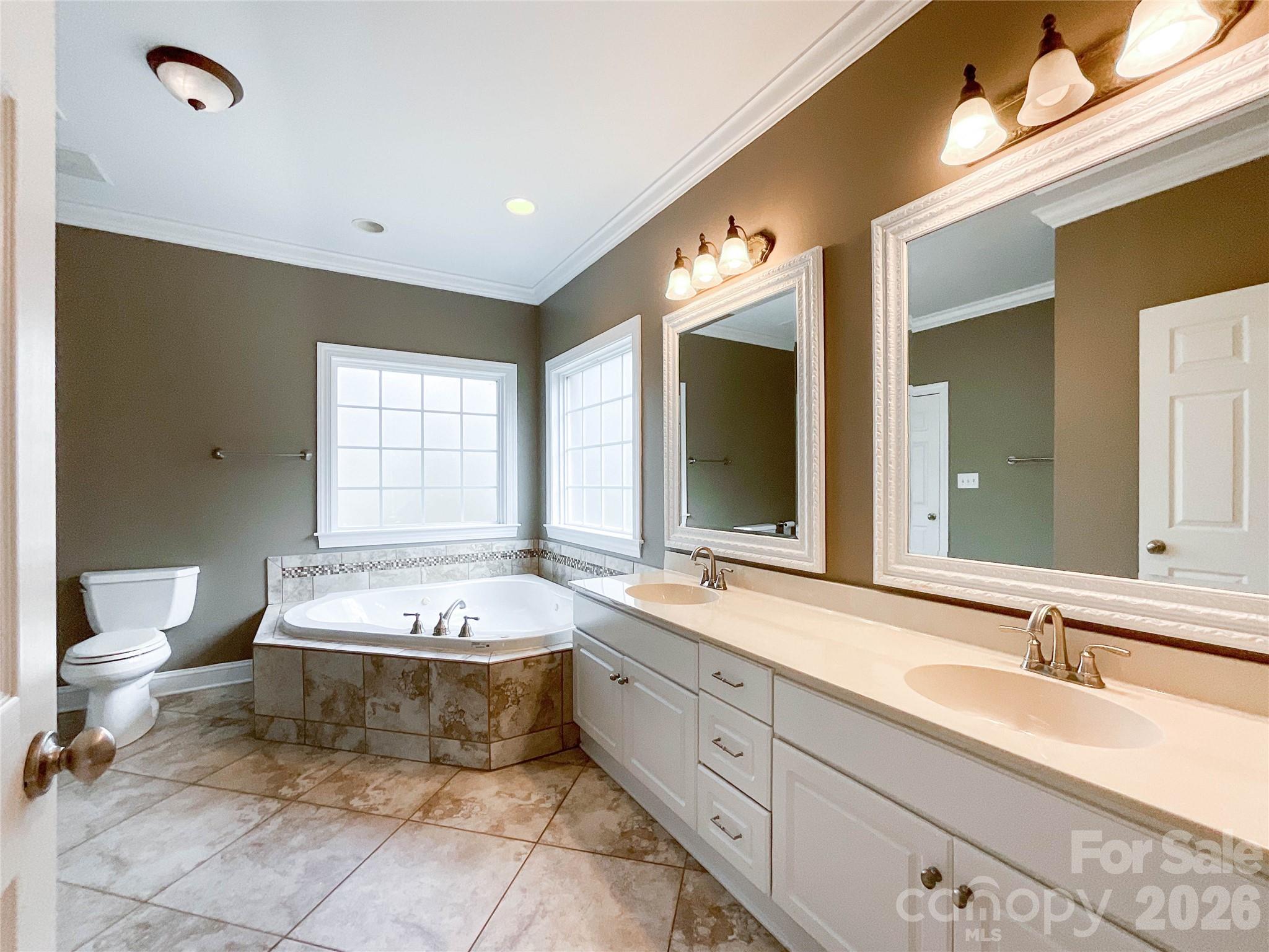 62 Will Evans Road Jefferson, SC 29718 - Photo 23 of 48 a spacious bathroom with a bathtub sink and mirror