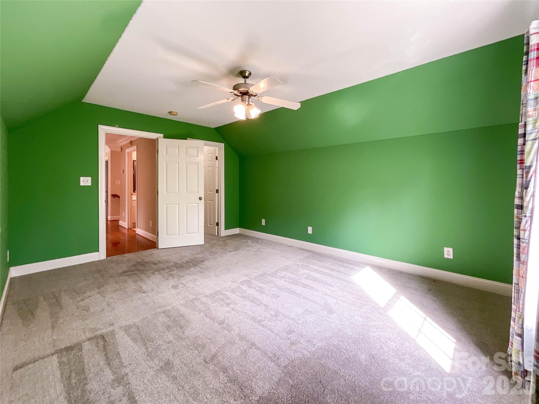 62 Will Evans Road Jefferson, SC 29718 - Photo 32 of 48 a view of a big room with a fireplace and fan