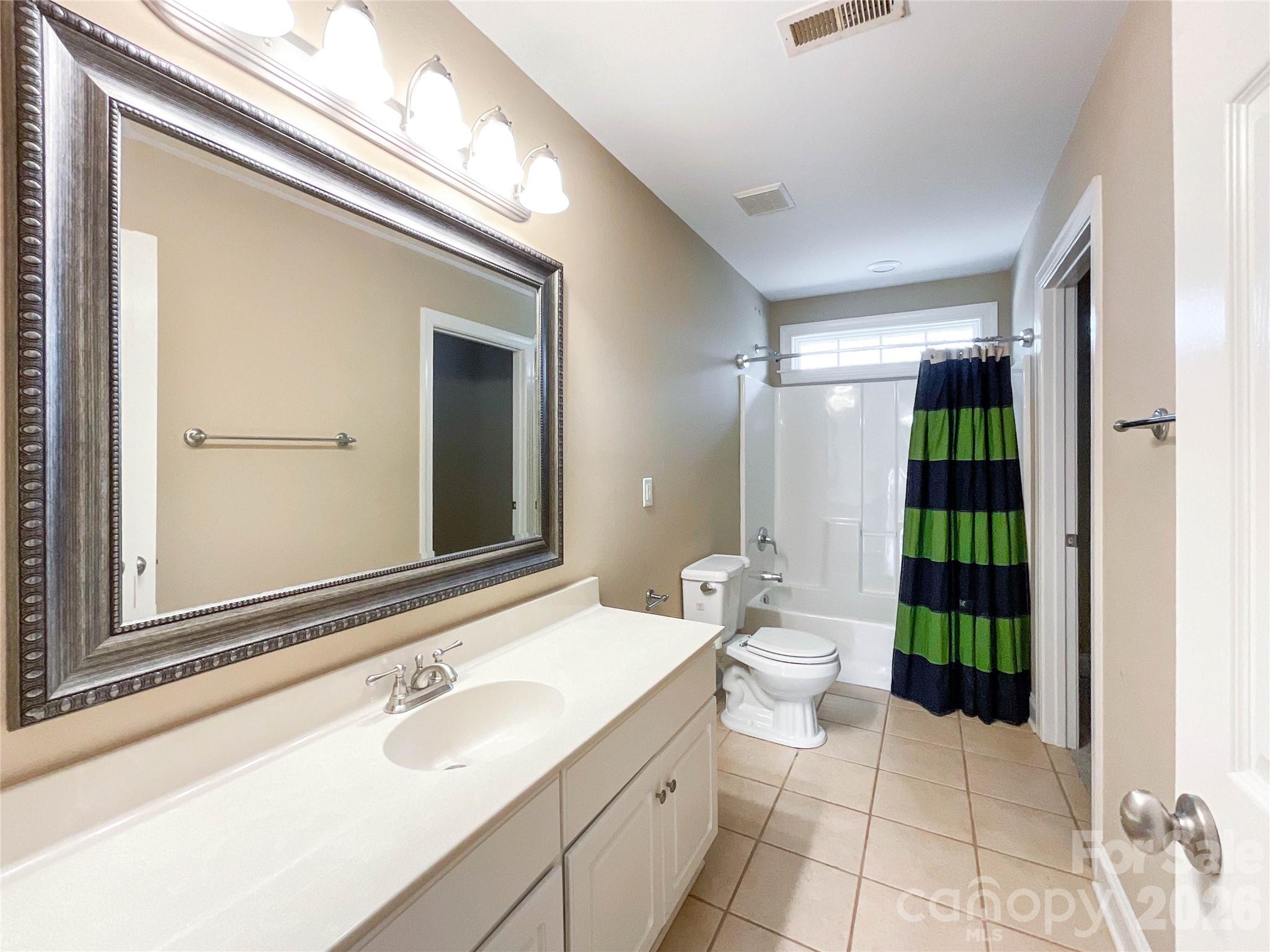 62 Will Evans Road Jefferson, SC 29718 - Photo 34 of 48 a bathroom with a double vanity sink toilet and shower