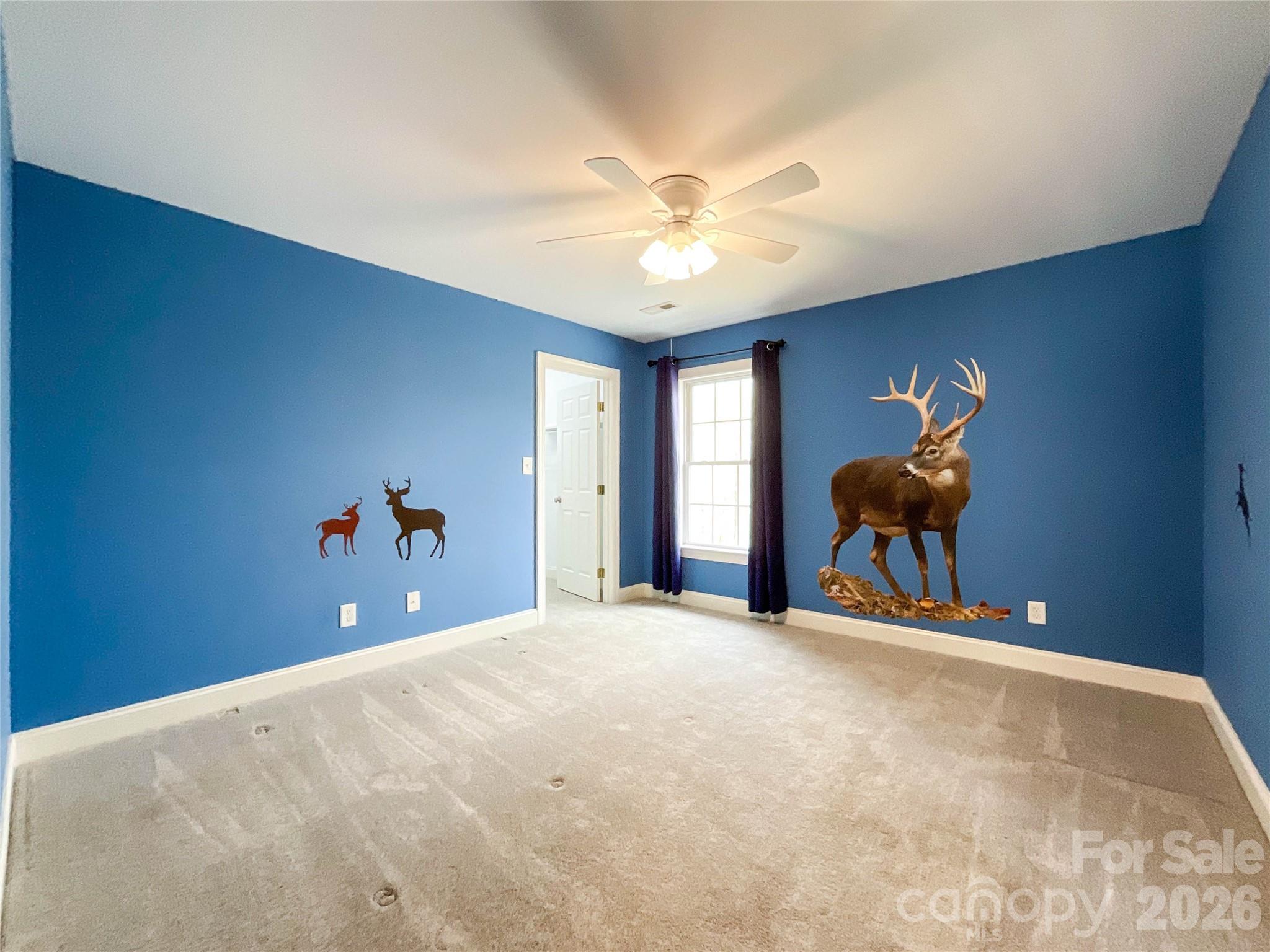 62 Will Evans Road Jefferson, SC 29718 - Photo 37 of 48 a bedroom with a bed and a chandelier