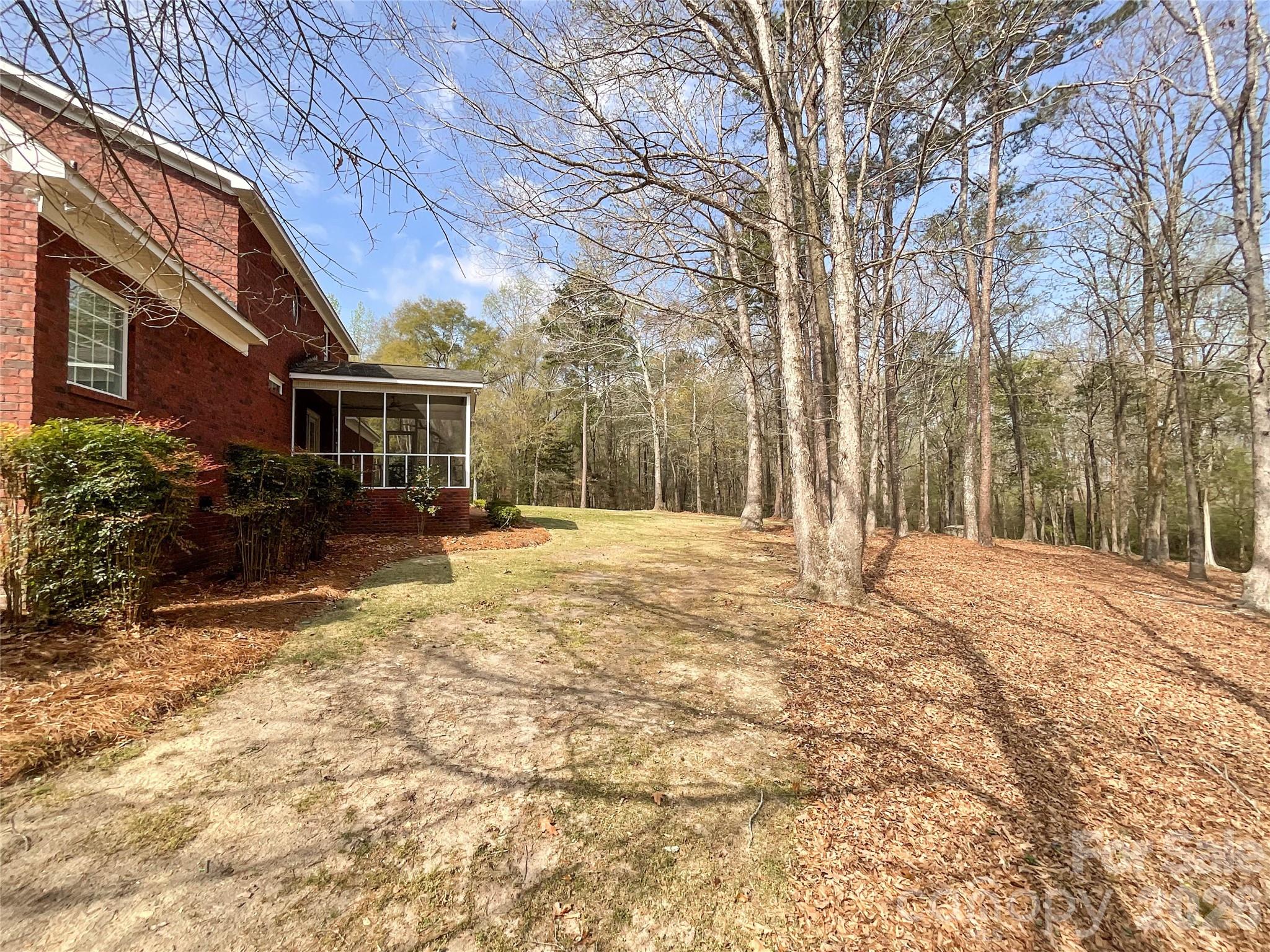 62 Will Evans Road Jefferson, SC 29718 - Photo 44 of 48 a house with trees in front of it