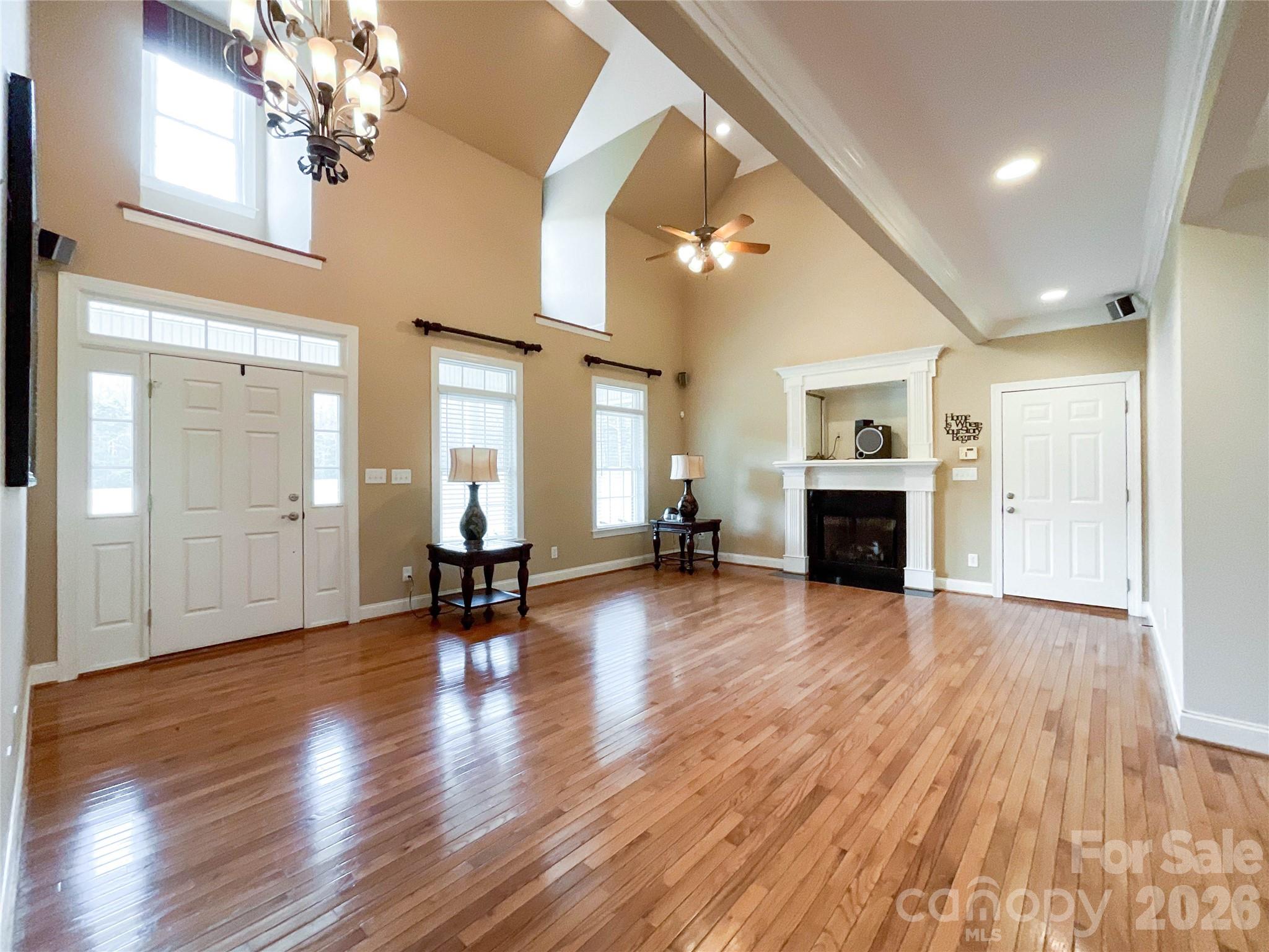 62 Will Evans Road Jefferson, SC 29718 - Photo 5 of 48 a view of a livingroom with fireplace wooden floor and a window