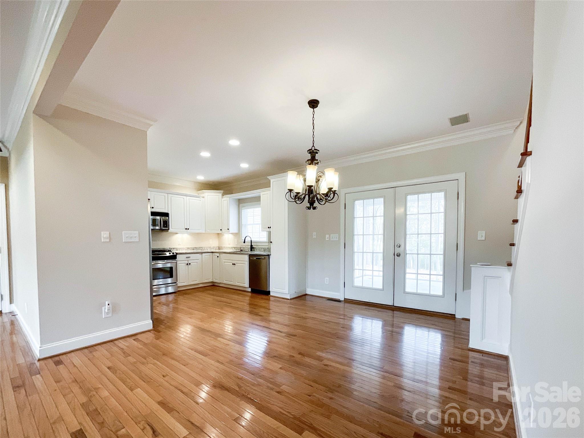 62 Will Evans Road Jefferson, SC 29718 - Photo 9 of 48 a view of a big room with wooden floor kitchen and windows