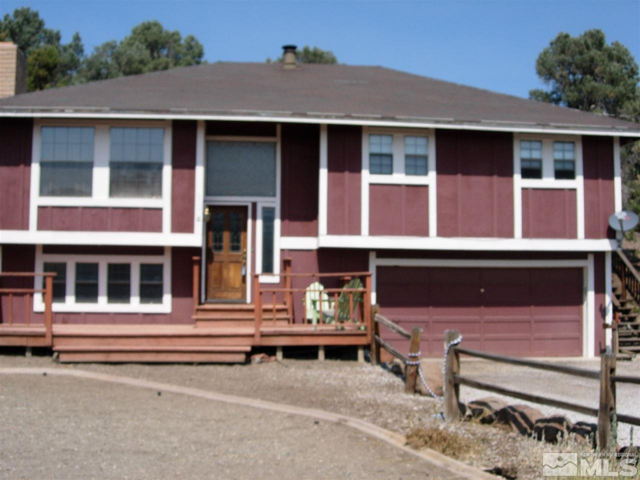 21930 Adobe Road Reno, NV 89521 - Photo 1 of 1 a front view of a house with a garden