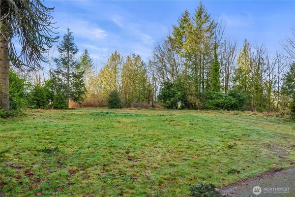 a view of outdoor space with deck and yard