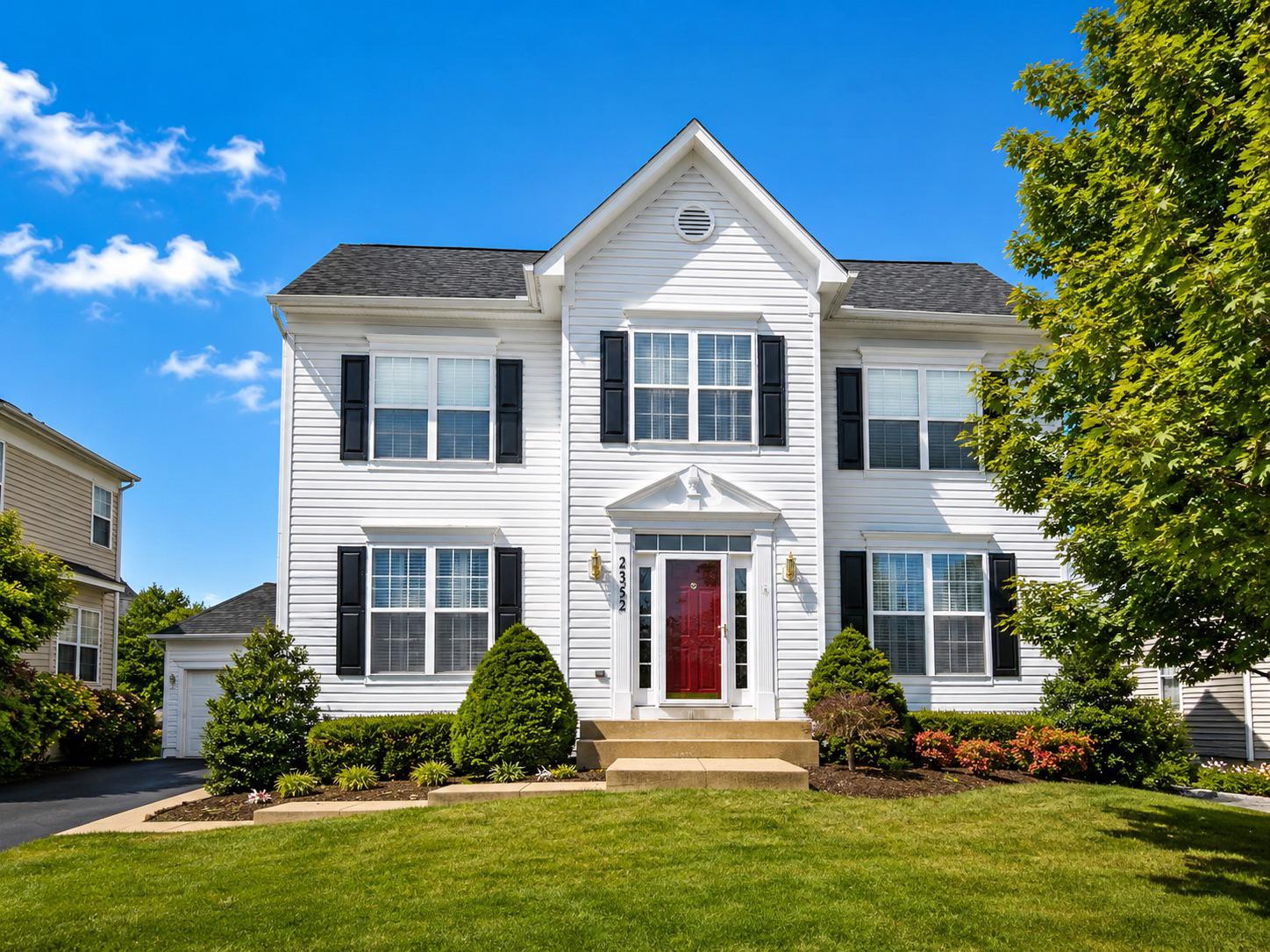 25352 Ripleys Field Drive Chantilly, VA 20152 - Photo 53 of 54 a front view of a house with a yard