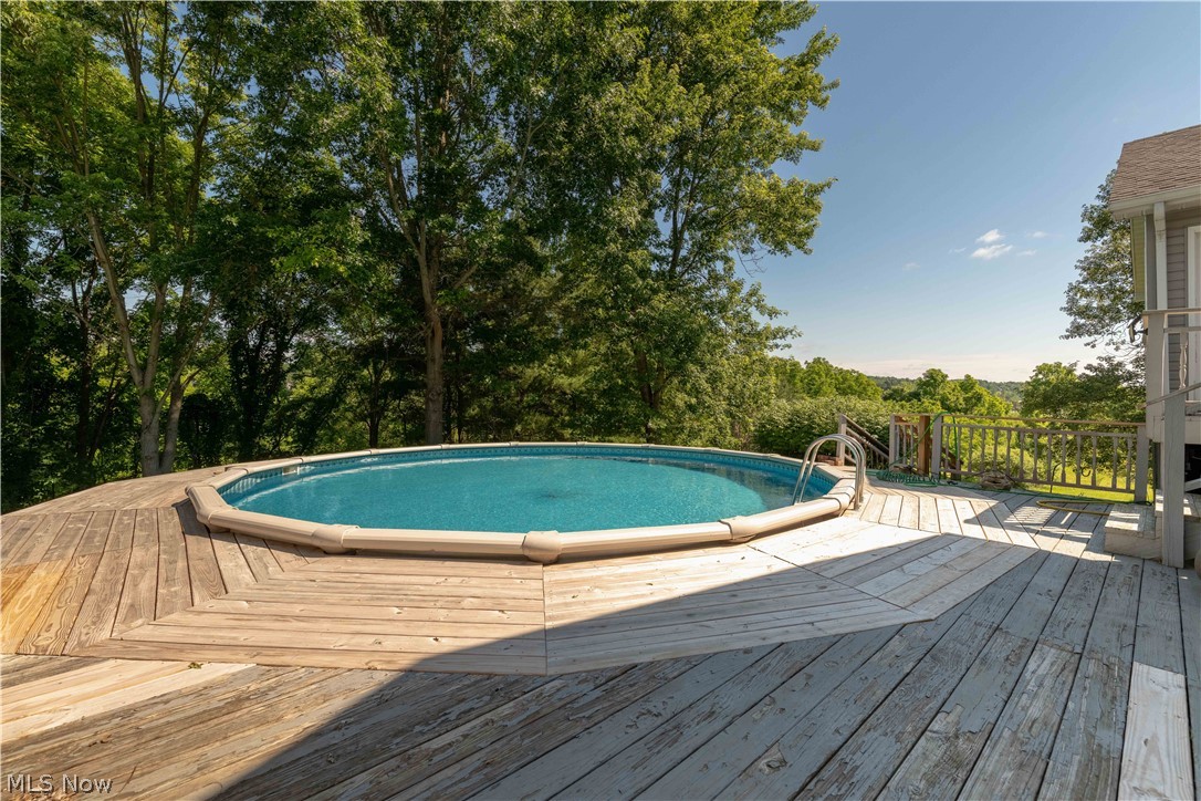 3963 Mark Road Cambridge, OH 43725 - Photo 44 of 50 View of pool with a wooden deck