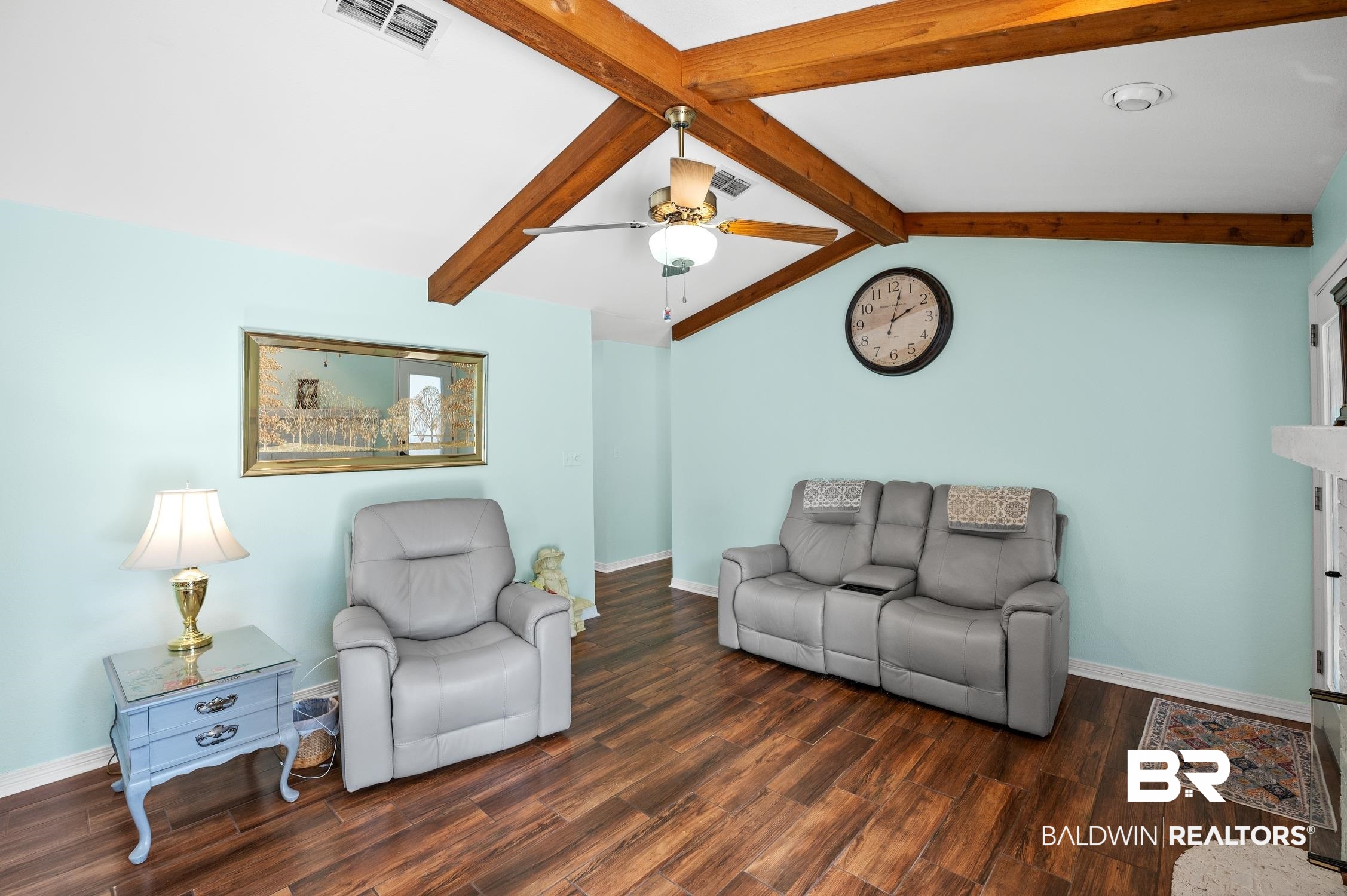 2553 Santa Rosa Drive Lillian, AL 36549 - Photo 9 of 51 Living room with dark wood-style floors, lofted ceiling with beams, visible vents, and baseboards