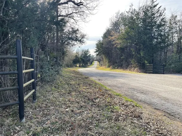 a view of outdoor space with trees all around