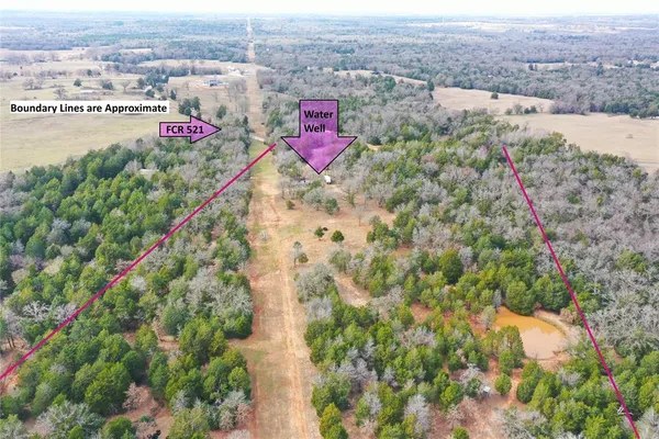 an aerial view of residential houses with outdoor space and swimming pool