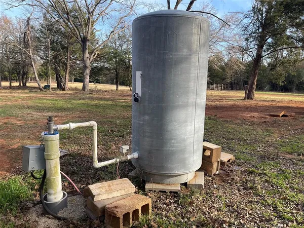 an aerial view of a houses with a yard