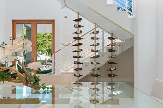 a living room with a fireplace a flat screen tv and a window