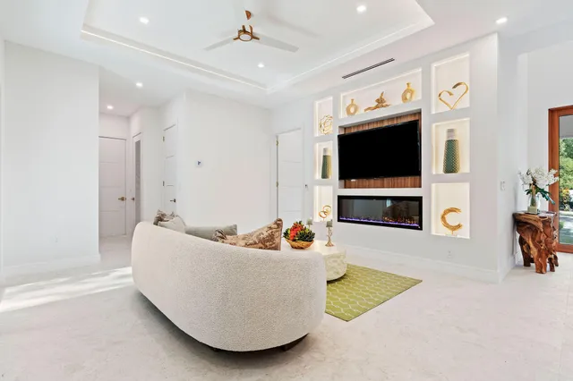 a kitchen with a refrigerator a stove a sink and a dining table