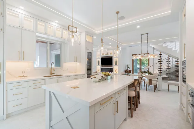 a kitchen with a refrigerator and cabinets