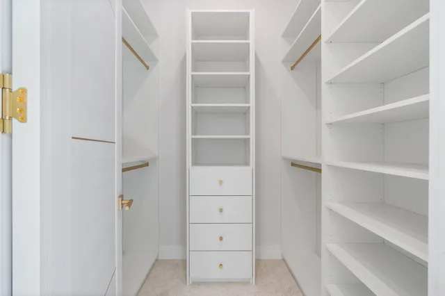 a view of a house with a yard patio and fire pit