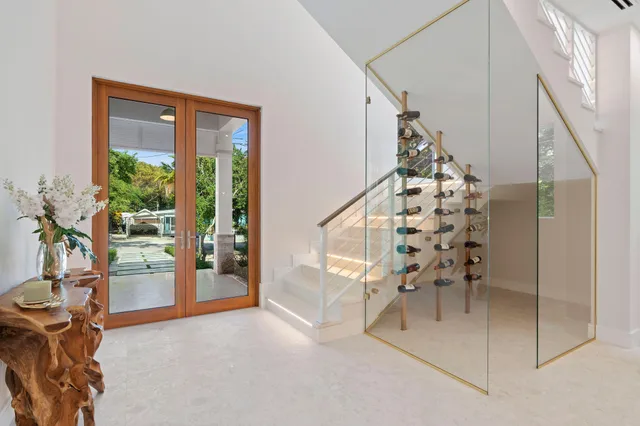 a view of a dining room with furniture and chandelier