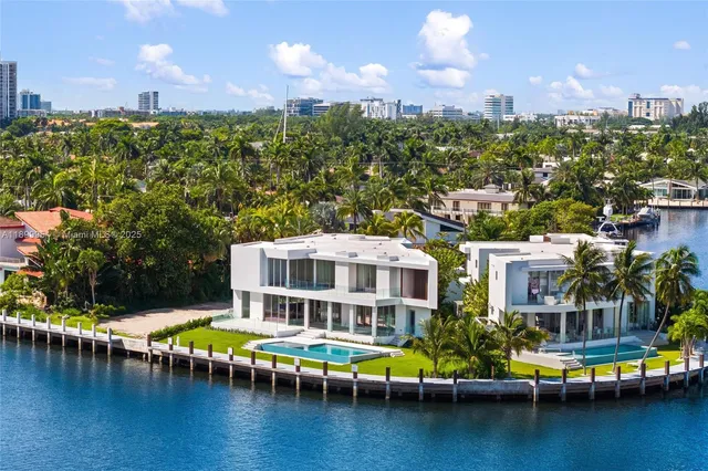 a view of a city with tall trees