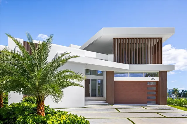 a front view of a house with a garage