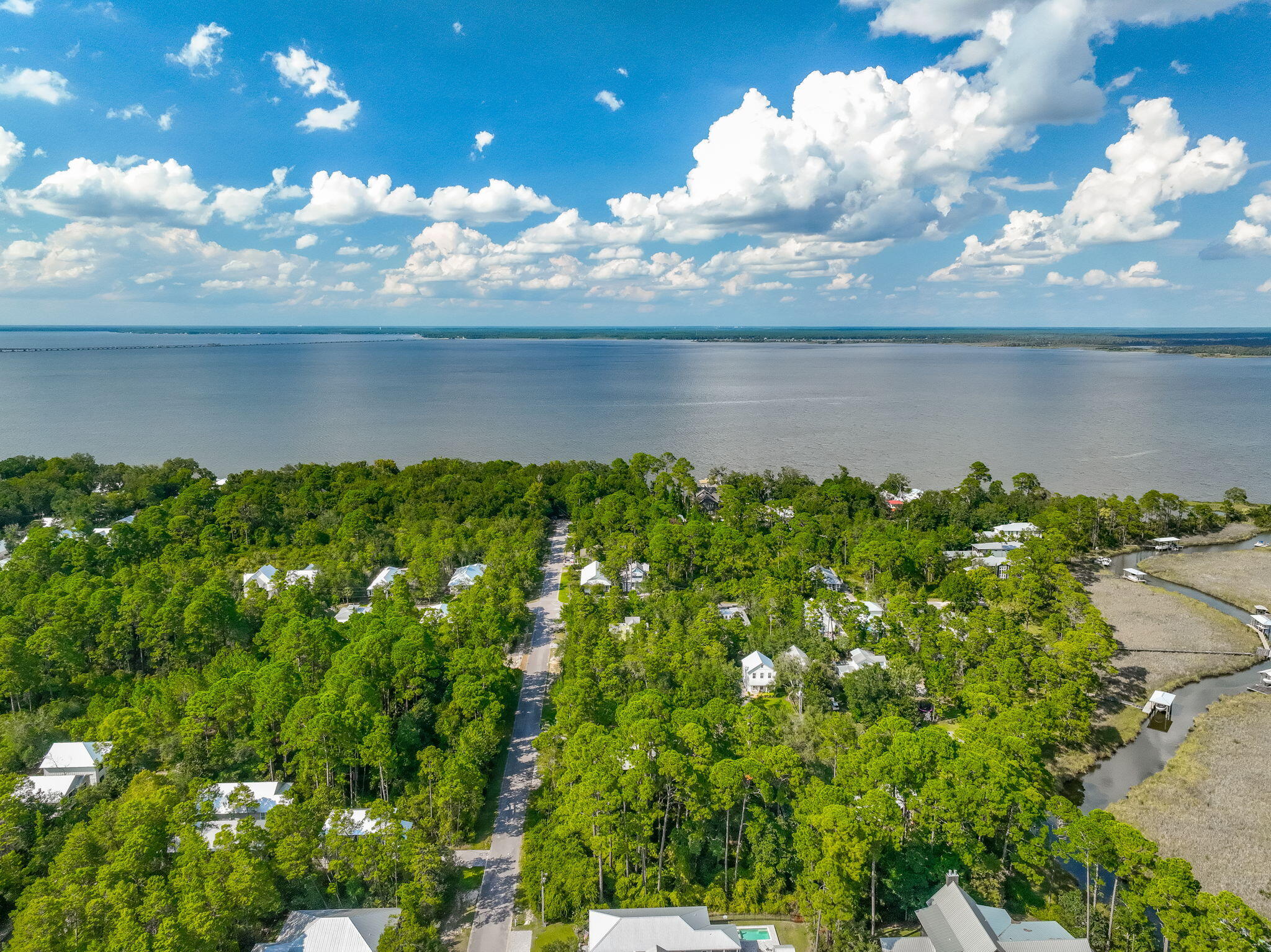 Lot 7 South Magnolia Beach Way Santa Rosa Beach, FL 32459 - Photo 7 of 21 a view of a lake with a building in the background