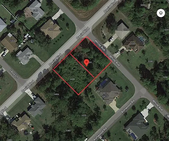 an aerial view of a residential houses with outdoor space