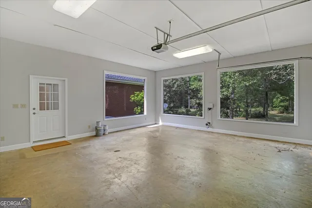 a view of a livingroom with a ceiling fan and window
