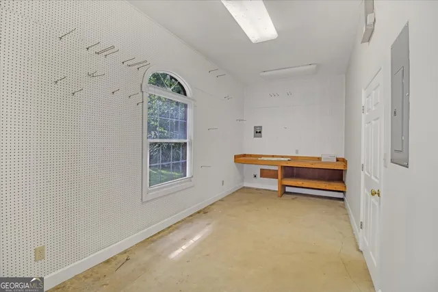 a room with a sink and cabinets