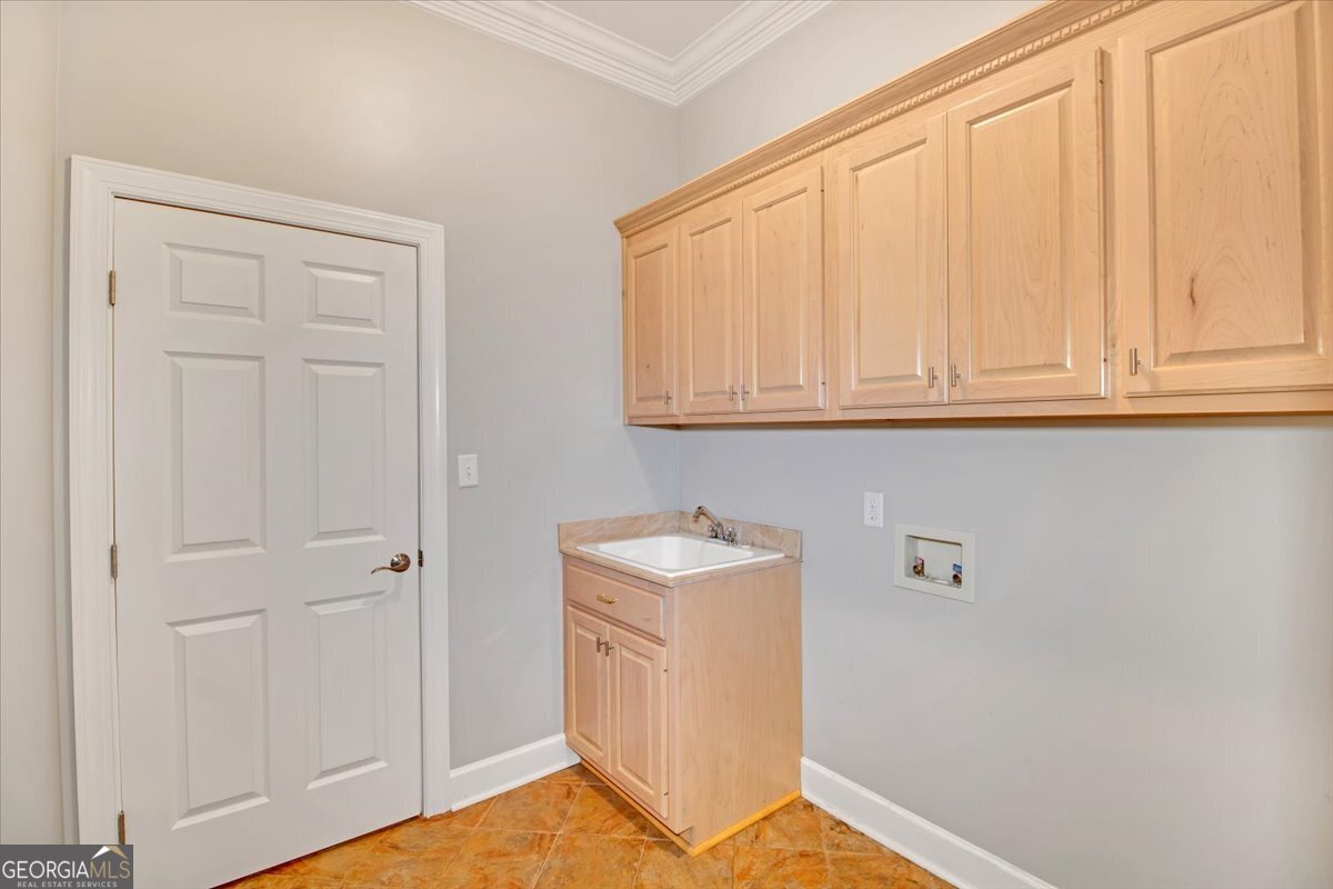 396 Meander Trace Thomasville, GA 31792 - Photo 15 of 50 a room with a sink and cabinets