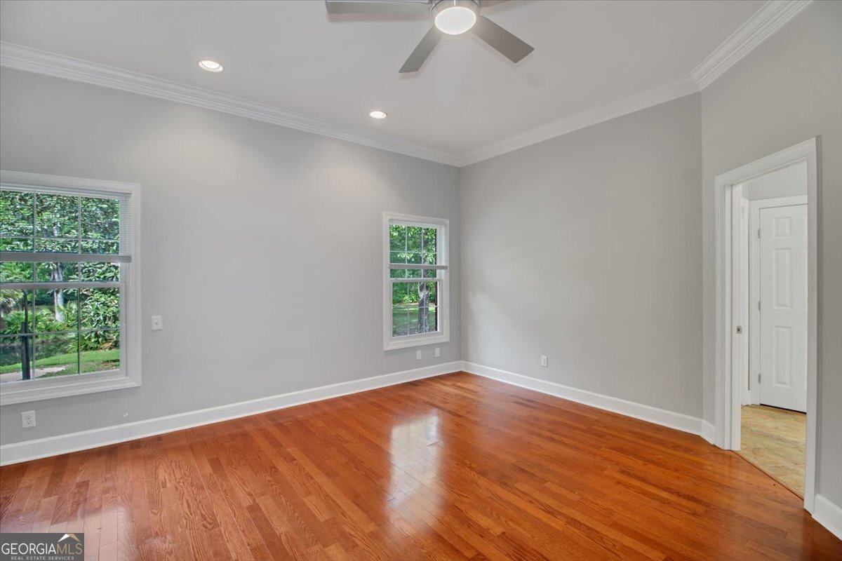 396 Meander Trace Thomasville, GA 31792 - Photo 17 of 50 wooden floor in an empty room with a window