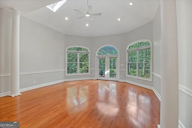 a view of kitchen with cabinets and wooden floor