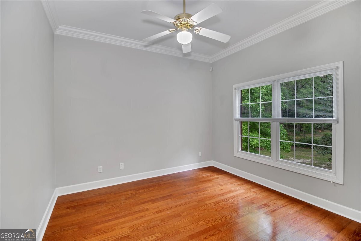 396 Meander Trace Thomasville, GA 31792 - Photo 29 of 50 an empty room with a window and a fan