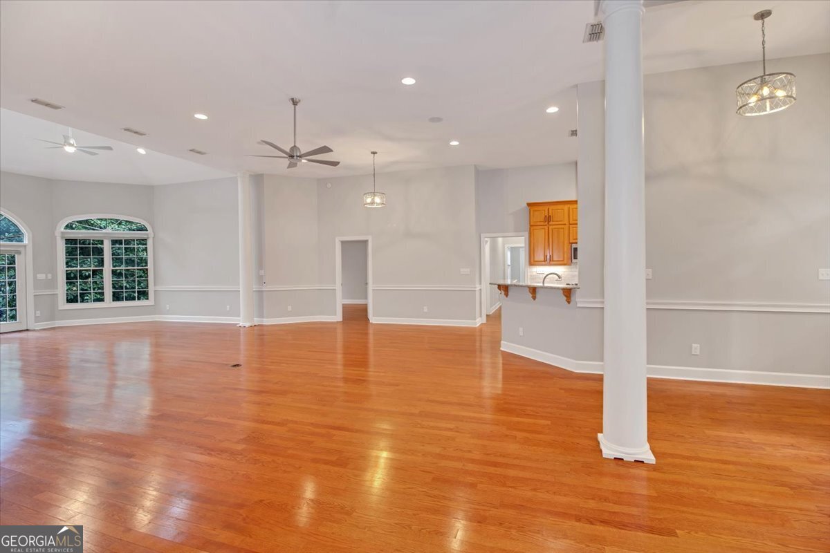 396 Meander Trace Thomasville, GA 31792 - Photo 33 of 50 a view of empty room with wooden floor and window
