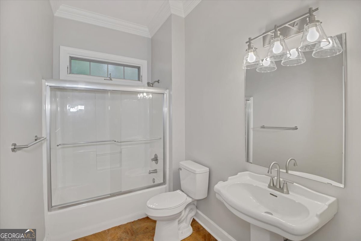 396 Meander Trace Thomasville, GA 31792 - Photo 35 of 50 a bathroom with a sink a toilet and shower