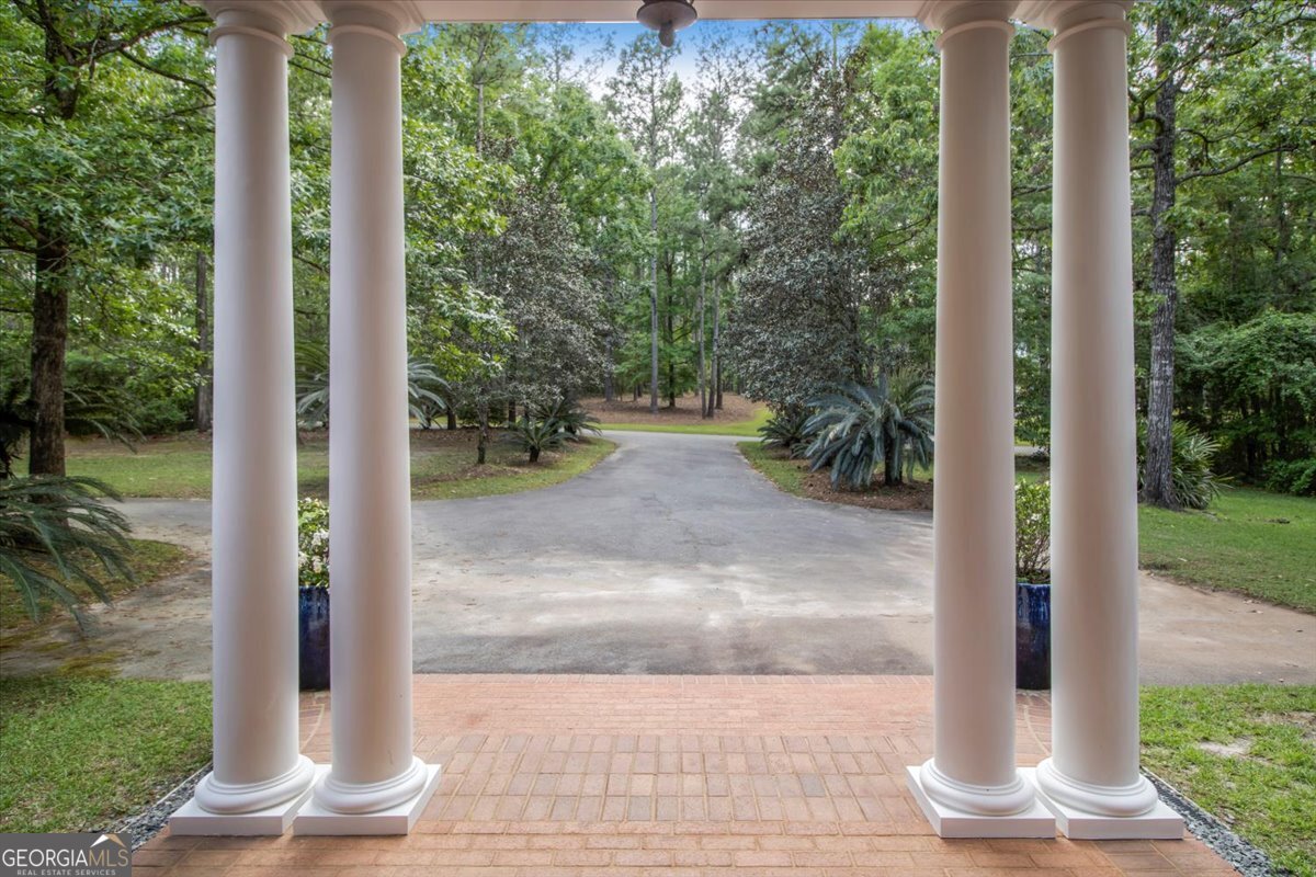 396 Meander Trace Thomasville, GA 31792 - Photo 37 of 50 a view of a pathway door front of house