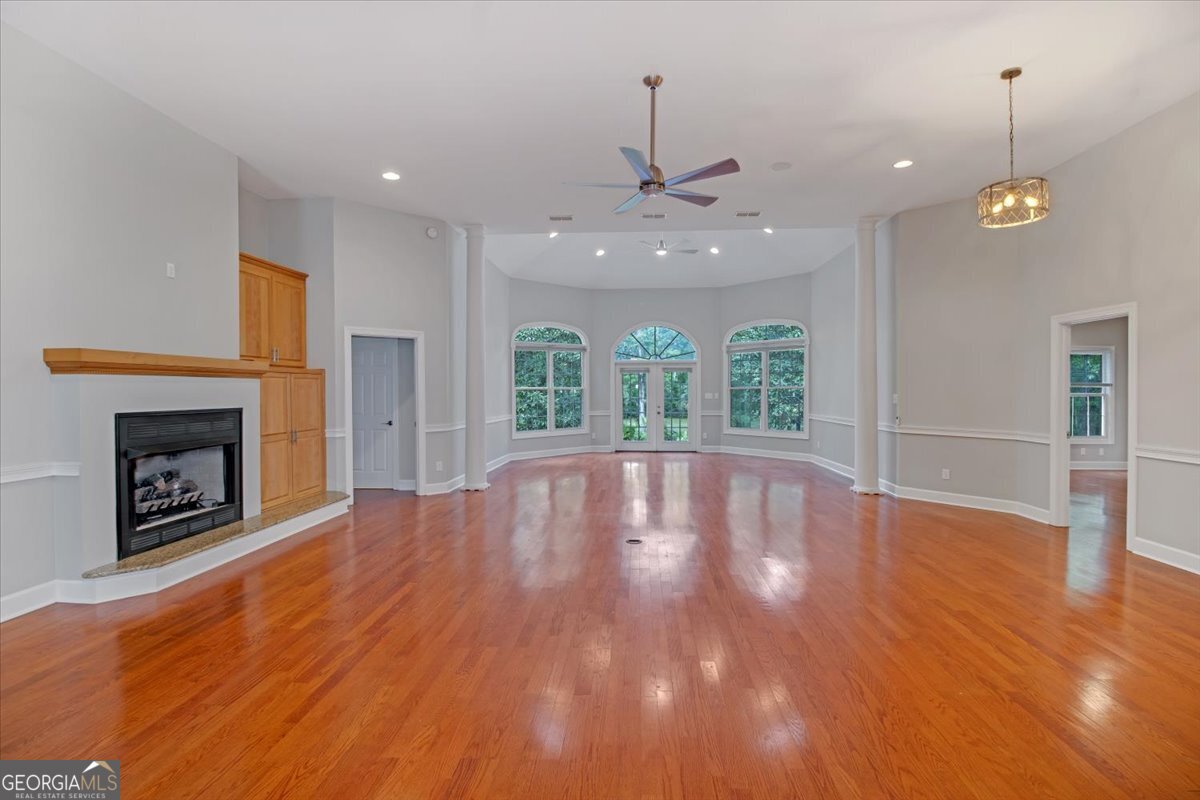 396 Meander Trace Thomasville, GA 31792 - Photo 4 of 50 a view of an empty room with wooden floor fireplace and a window