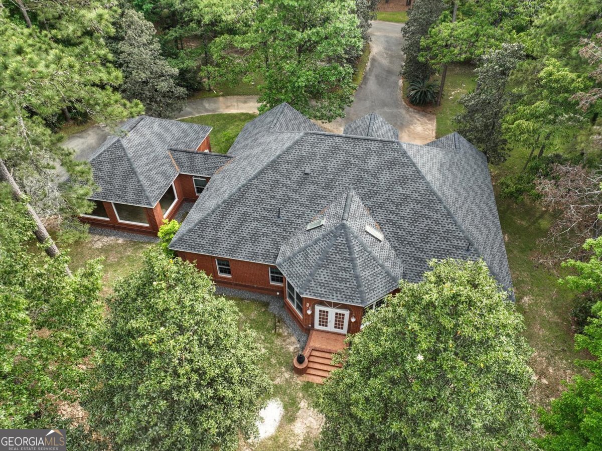 396 Meander Trace Thomasville, GA 31792 - Photo 45 of 50 an aerial view of a house with a yard and large trees