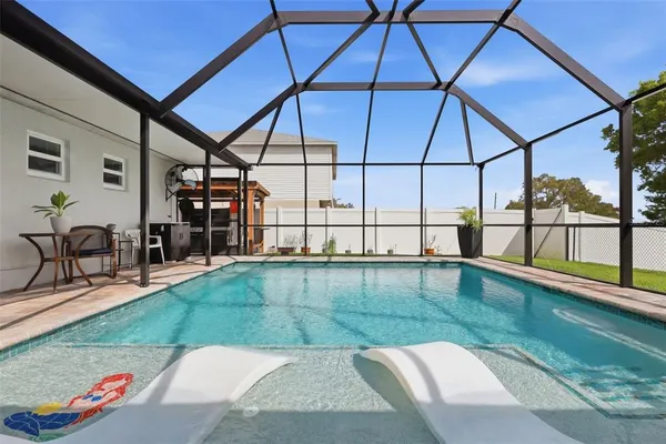 a view of a swimming pool with a patio