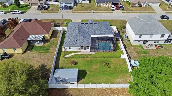 an aerial view of a house with swimming pool