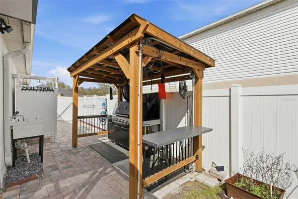 a house with green field in front of it