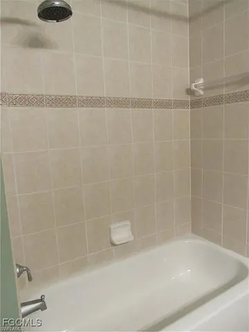 a close up of a bathtub in a bathroom