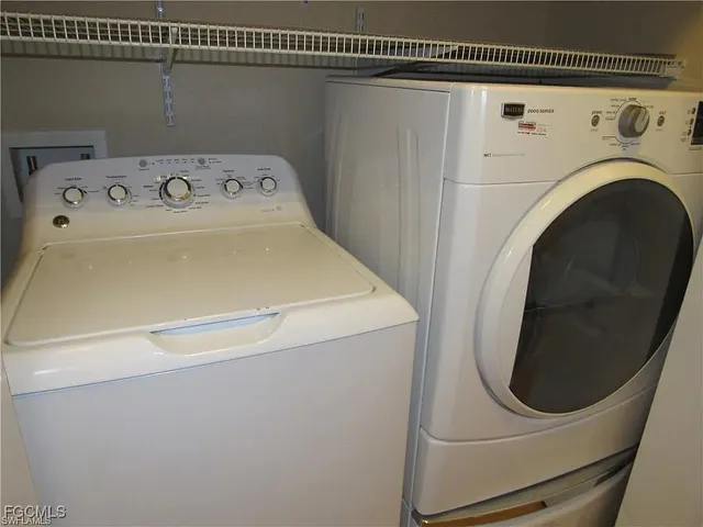 a utility room with dryer and washer