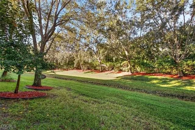 a view of backyard with green space