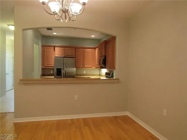 a view of kitchen with wooden floor