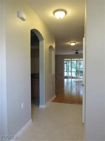 wooden floor in a hall with a window