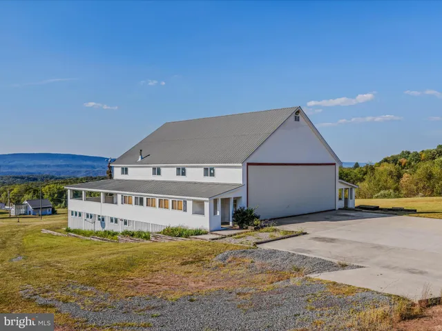 a view of a house with a big yard