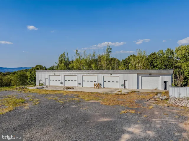 a view of a yard with an house in background