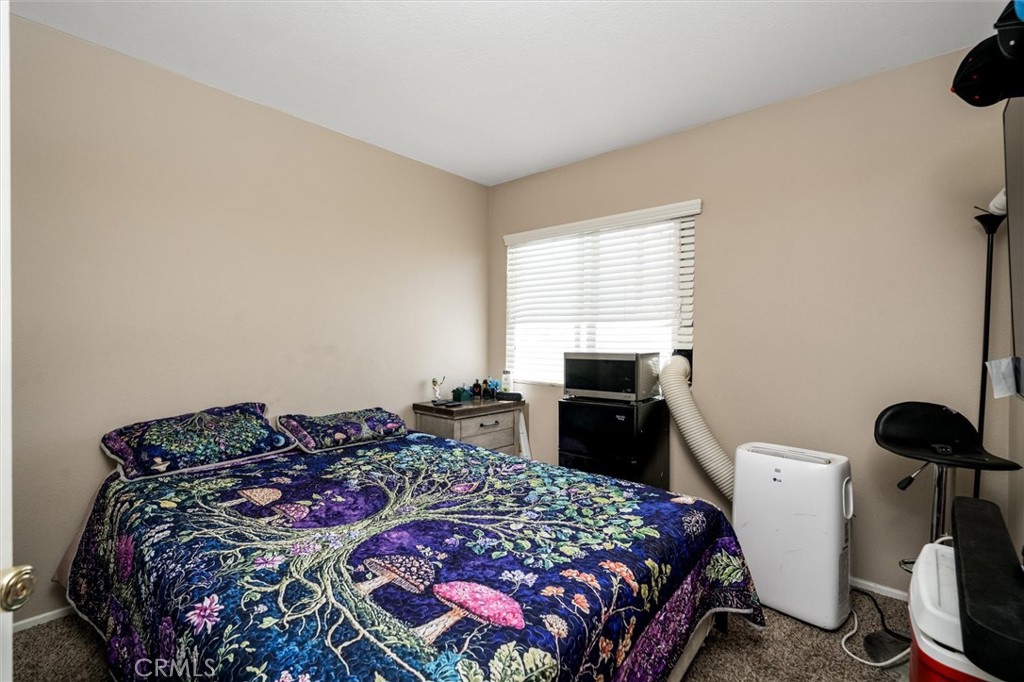 37867 Shady Maple Road Murrieta, CA 92563 - Photo 44 of 68 a bedroom with a bed and a window